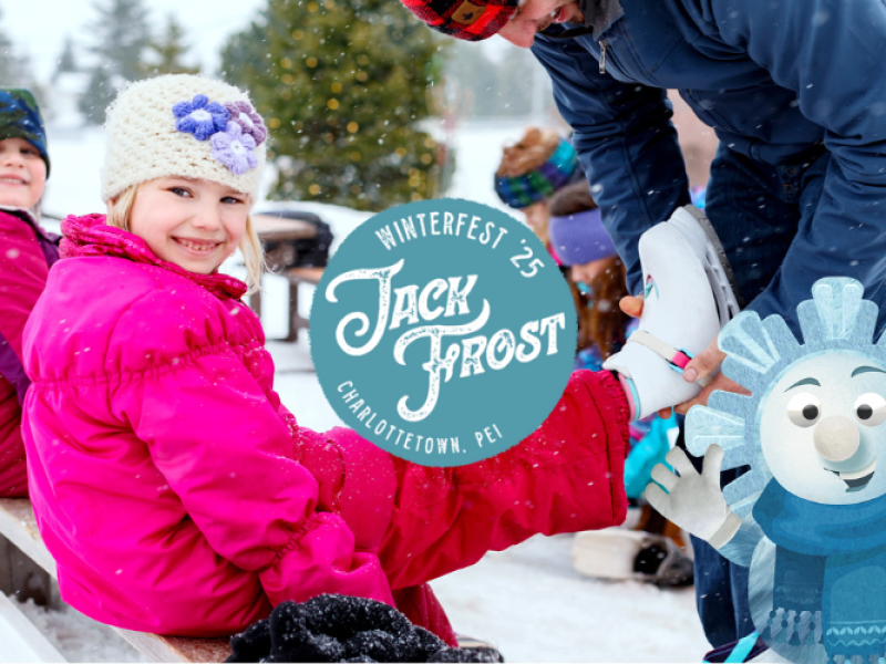 Image of man with two children tying skates at outdoor rink