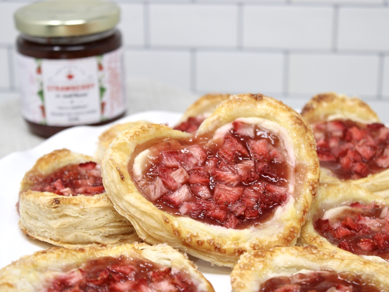 Plated Strawberry Sweetheart Pastries with bottle of PEI Preserve Co jam in background