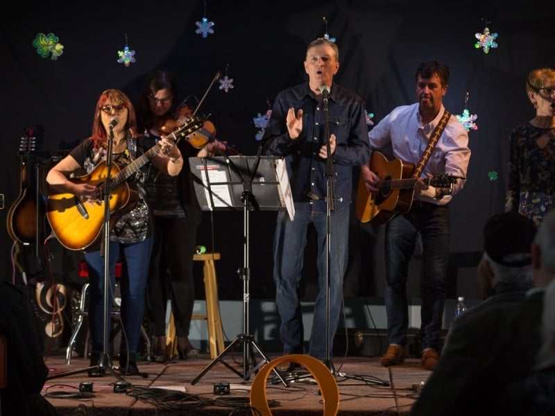 Image of Tip Er Back band performing with friends on stage