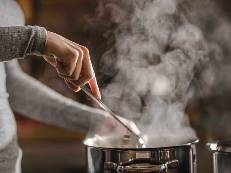 Cook making chowder