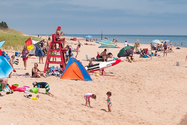 View of Basin Head Provincial Park beach on a busy day in summer