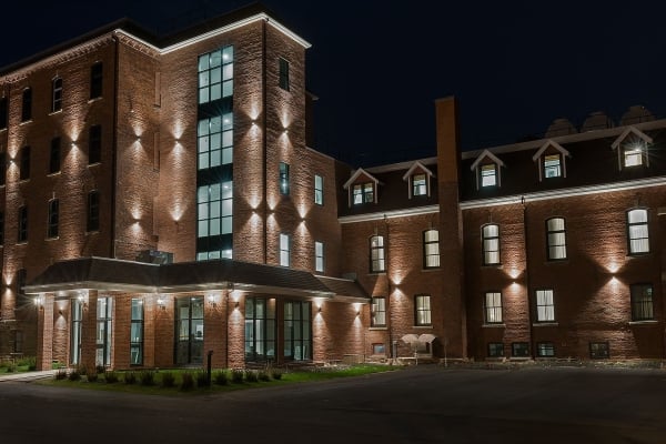 Exterior view of The Sydney Boutique Inn & Suites at night