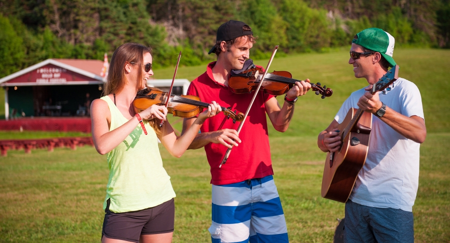 Group playing music, fiddle, guitar