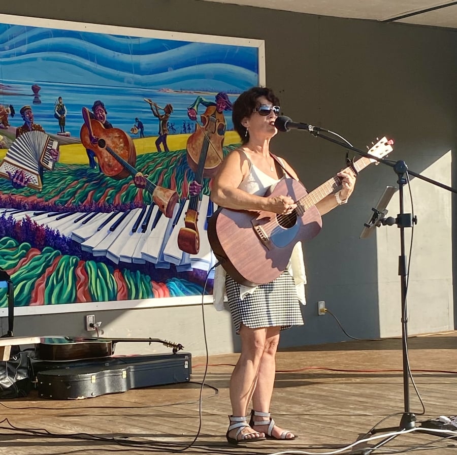 Kelley Mooney performs in the outdoor gazebo at the Kensington Railyards