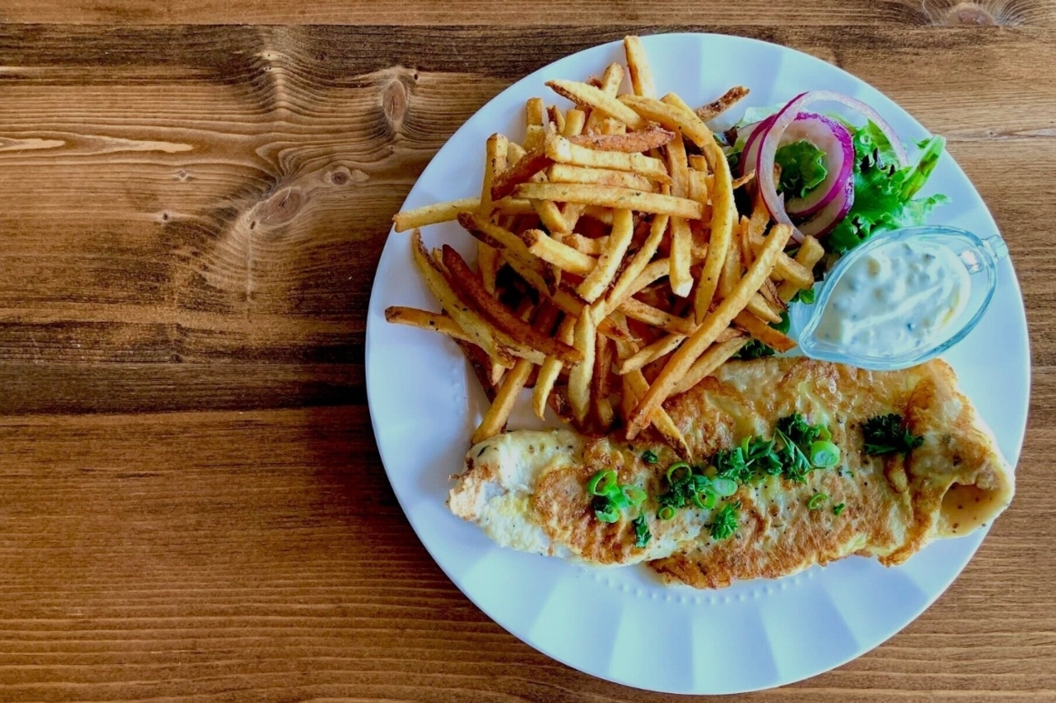 Portuguese Fish and Chips plated on table at 21 Breakwater 