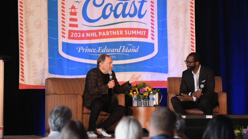 NHL Commissioner Gary Bettman speaks with guest at NHL Partner Summit at convention centre in Charlottetown