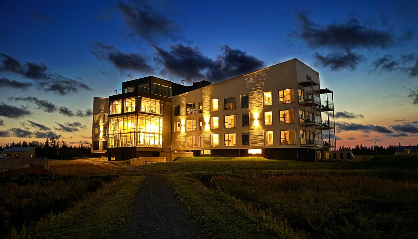 The Hotel Acadia at Blackbush Beach Resort at night