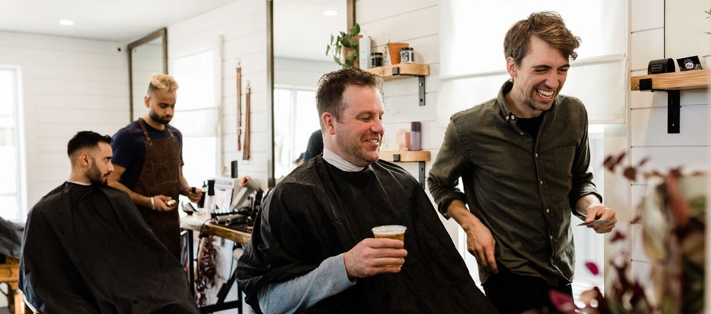 Clients and staff enjoying services at Humble Barber