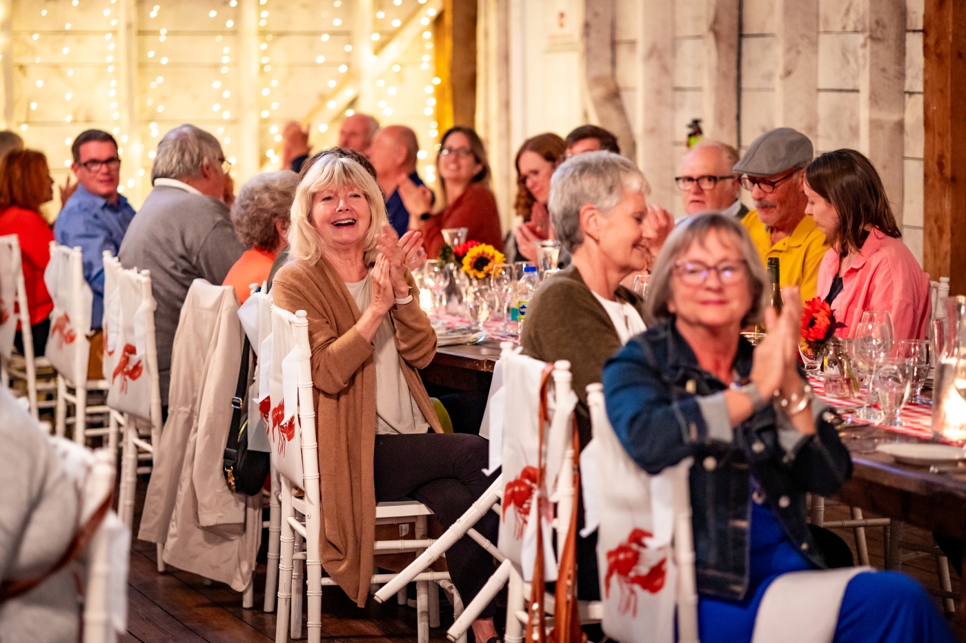 Group of people seated at tables for Fall Flavours event