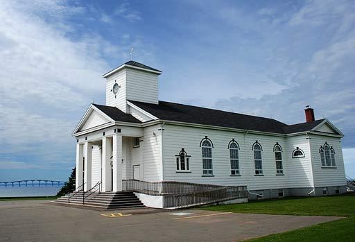 Exterior view of St. Peter's Cathollic Church, Seven Mile Bay with view of Confederation Bridge in the distance